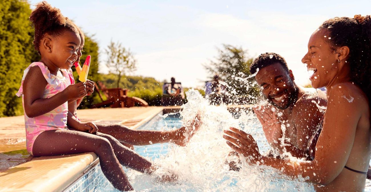 us family smiling in the pool